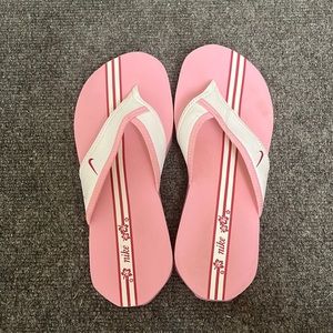 Pink Nike flip flops